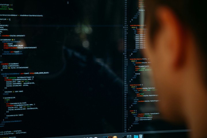 A developer looking at a screen with code on it